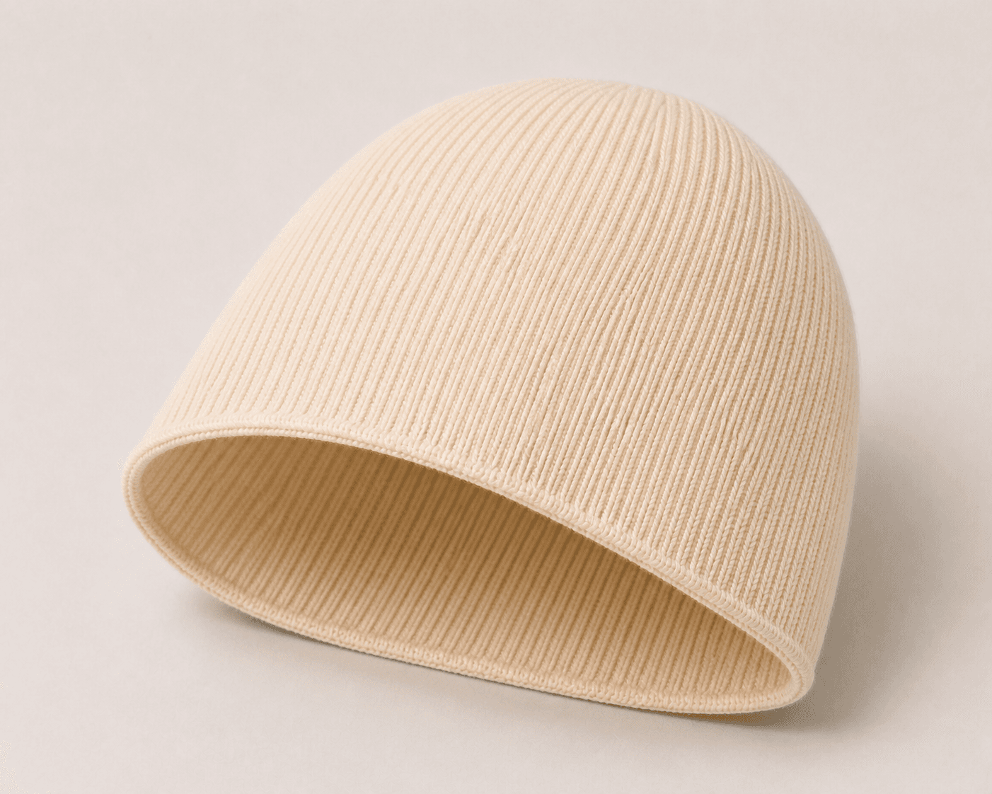 Nūr Signature Beanie in Bone, skully inside construction detail